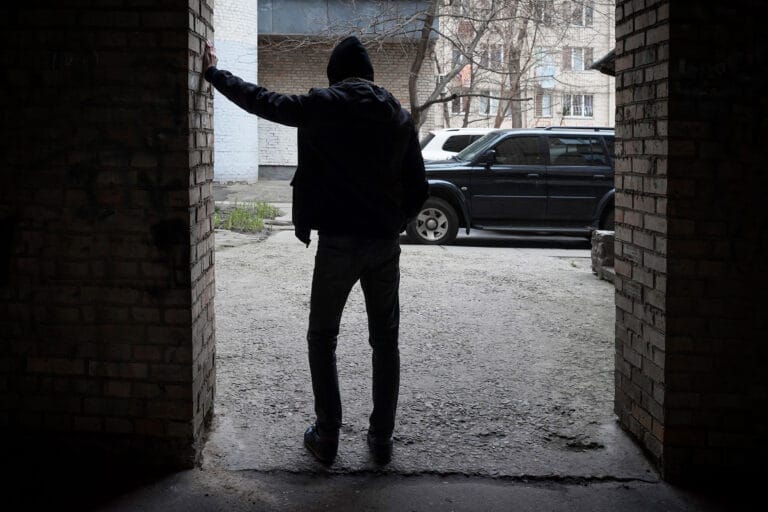 person leans against wall and considers the long term effects of cocaine